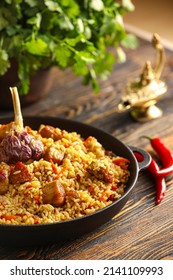 Frying Pan With Tasty Asian Pilaf On Table