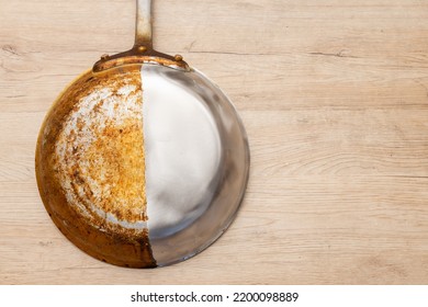 A frying pan that is half burnt and half polished - Shutterstock ID 2200098889