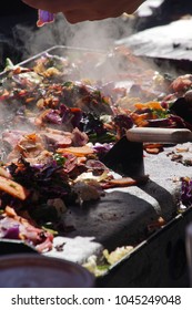 Frying Vegetables On A Grill At The Ballard Farmer's Market On A Spring Day In 
Seattle, Washington