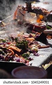 Frying Vegetables On A Grill At The Ballard Farmer's Market On A Spring Day In 
Seattle, Washington