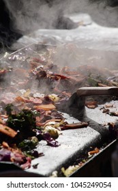 Frying Vegetables On A Grill At The Ballard Farmer's Market On A Spring Day In 
Seattle, Washington