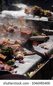 Frying Vegetables On A Grill At The Ballard Farmer's Market On A Spring Day In 
Seattle, Washington