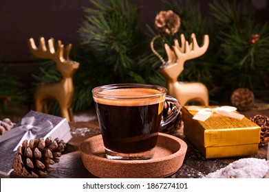 FSmall Cup Of Black Coffee. Ragrant Espresso And Christmas Decor On A Wooden Table. Italian Black Coffee With Foam. New Year's Break. Copy Space. High Quality Photo