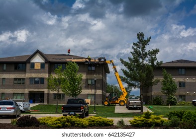 Ft Dodge Iowa United States-5/17/2017 Workers Trying To Repair Damage After A Big Storm 