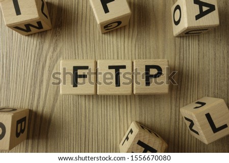 ftp - file transfer protocol word from wooden blocks on desk