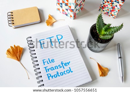 FTP,  File Transfer Protocol written in a notebook on white table