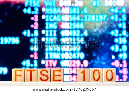 ftse 100 concept. wooden blocks with the inscription ftse 100