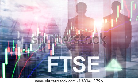 FTSE 100 Financial Times Stock Exchange Index United Kingdom UK England Investment Trading concept with chart and graphs.