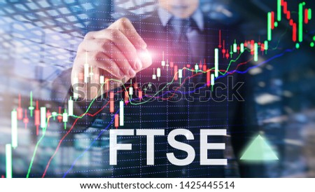 FTSE 100 Financial Times Stock Exchange Index United Kingdom UK England Investment Trading concept with chart and graphs.