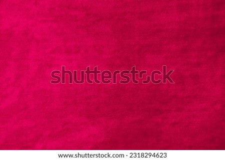 Fuchsia velvet textured background. Intensive pink color as blank canvas for banner or poster graphic design with space for logo or text. Vibrant grunge rough abstract backdrop for photography