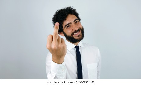 Fuck You. Handsome Brunette Man With Shirt Giving  The Finger.