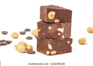 Fudge On A White Plate With Nuts And Chocolate Diced