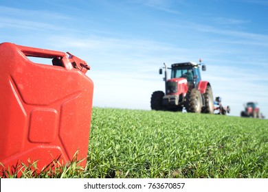 Fuel And Agriculture Machines. Gas Can And Tractor In The Field. Biodiesel And Petrol Production.