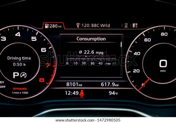 Fuel consumption display in instrument cluster of\
modern car.  Fuel economy is one of the most important factors to\
consider when buying a new car. Car gas mileage theme, fuel\
consumption concept