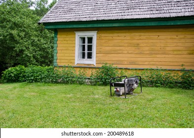 Fuel Diesel Electricity Generator Work Near Rural House In Village. 