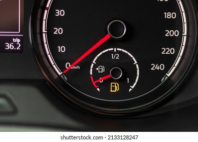 Fuel discharge warning light on the dashboard of the car. The low fuel level is displayed on the dashboard of the speedometer