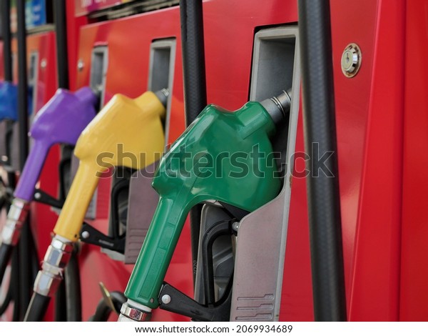 fuel dispenser. The\
green fuel nozzles are arranged in several colors. Gasoline and\
diesel service stations. The green fuel dispenser is installed in\
the red oil dispenser.