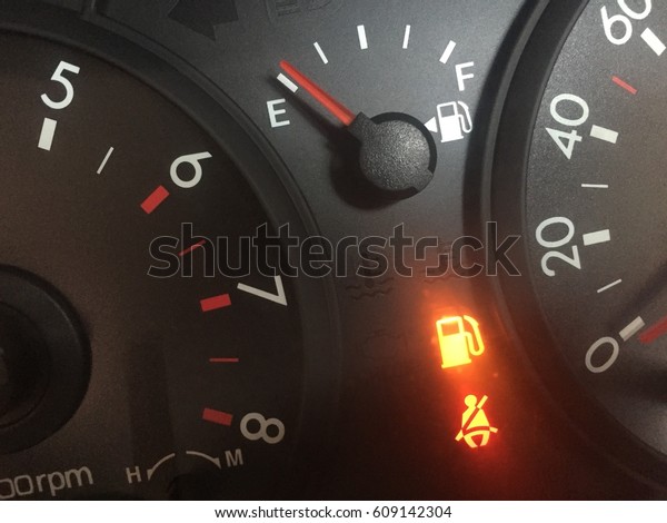 Fuel is empty as\
shown on fuel gauge of a\
car