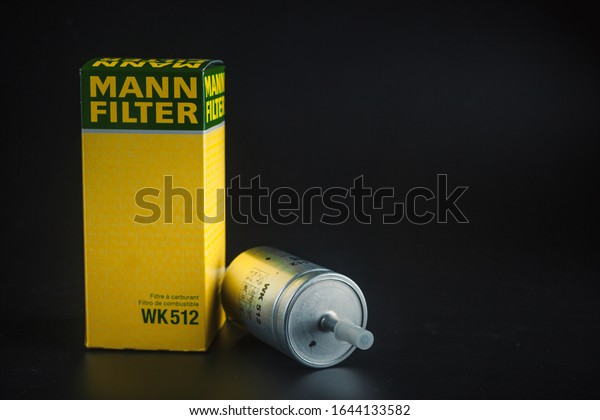 Fuel filter Mann on black background. Gasoline\
filter mann