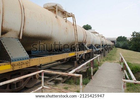 Fuel freight train, running but rusty. Argentine countryside industry train