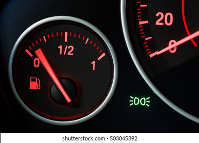 Fuel gage with motion blurred needle. - Powered by Shutterstock