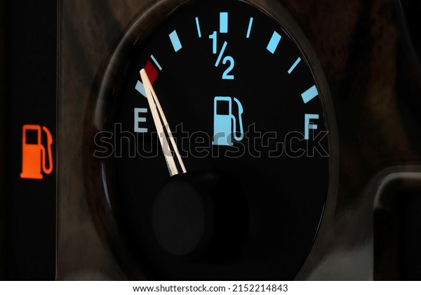 fuel gauge in car dashboard in illuminated night\
mode  - empty