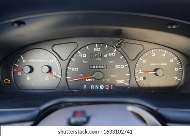Fuel gauge, vehicle engine temperature, Miles Per Hour Speed indicator, and revolutions per minute indicator on a car dashboard in Fond du Lac, Wisconsin 