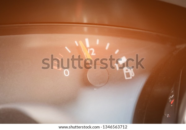 Fuel indicator.\
Interior of a modern car.