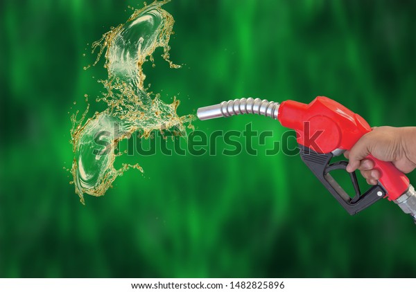 Fuel nozzle Hand holding oil\
extracted oil Splashes background blur from the background,\
clipingpart