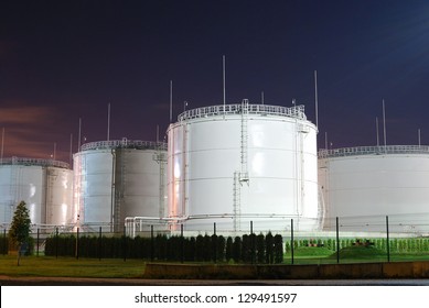 Fuel Storage Tanks At Oil Terminal By Night