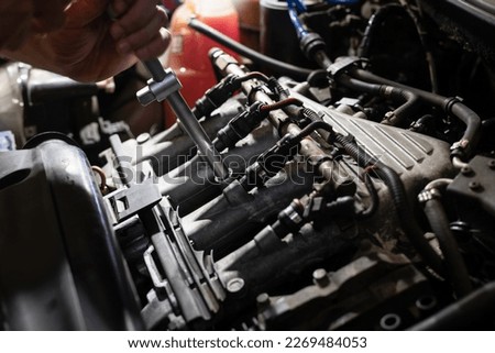 Fuel system. Car maintenance. Repairman. Auto service. Car engine maintenance.
