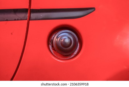 Fuel Tank Lid Of A Red Small Car