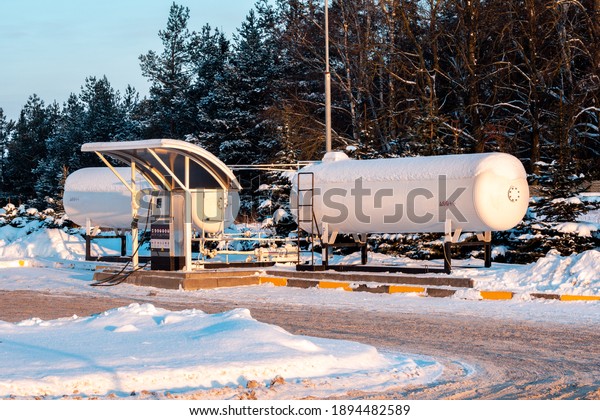 Fuel tank of\
liquid propane gas station. Fuel tank of LPG station under snow.\
Winter view of LPG station for filling liquefied gas into the\
vehicle. Environmentally friendly\
fuel.