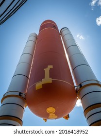 A Fuel Tank And Rocket Boosters Outside A Science Museum.