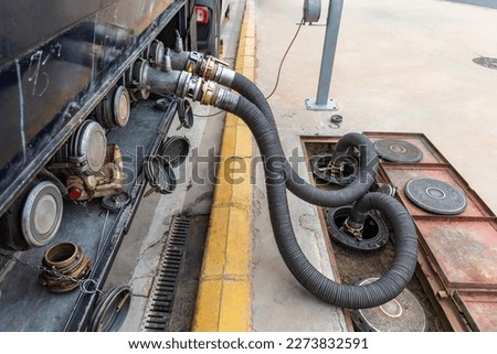 Similar – Foto Bild Zwei Tanklastzüge überqueren eine Autobahn über eine Brücke, Luftaufnahme.