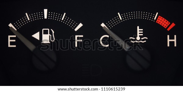 Fuel and tempreture indicators in modern car close\
up view