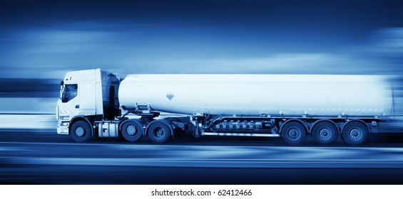 fuel truck in motion on highway and blurred background, monochromatic