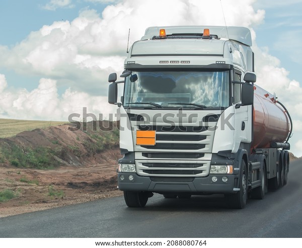 Fuel truck\
is moving along a country road.\
Close-up