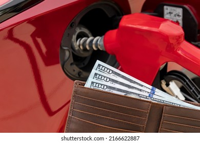 Fueling Car At Gas Station With Cash Money In Wallet. Gas Price Increase, Tax And Fuel Shortage Concept.