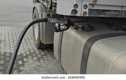 Fueling up a freight transport truck. Dirty autotruck on the road. Commercial vehicle. Truck refuel action close-up Petrol Tanker.  - Shutterstock ID 1838485900