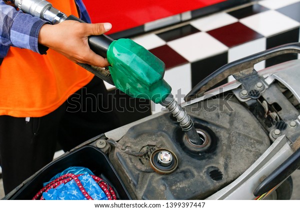 Fueling the motorbike for\
traveling
