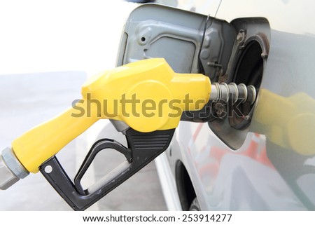 fueling /Yellow Oil dispenser refill to the car