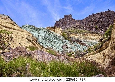Fuente de los Azulejos seen from the road that leads from Mogán to the Aldea de San Nicolás. Emerald green rock formation in the mountains of the Inagua Integral Nature Reserve, in Gran Canaria.