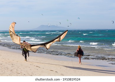 FUERTEVENTURA, SPAIN - May 10, 2013. Kite Surfing Couple Walking On The Beach In Corralejo, Fuerteventura, Canary Islands