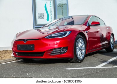 FUERTH / GERMANY - MARCH 4, 2018: Tesla logo on a Tesla car Tesla, Inc. is an American company that specializes in electric automotives, energy storage and solar panel manufacturing.
