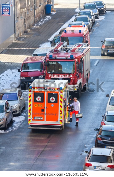 FUERTH / GERMANY -\
MARCH 4, 2018: German emergency service vehicles stands on street\
near an accident in a\
house