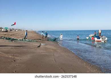 FUJAIRAH, UAE - DEC 14: Fishermen preparing their nets at the beach of Kalba. December 14, 2014 in Fujairah, United Arab Emirates
