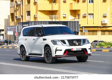 Fujairah, UAE - November 18, 2018: White Luxury Offroad Car Nissan Patrol Nismo In The City Street.