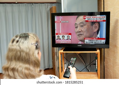 Fuji City, Shizuoka, Japan - September 14, 2020: Woman Watching The Press Conference Live Broadcast On Japanese Television By Yoshihide Suga, The Next Prime Minister Of Japan.