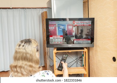 Fuji City, Shizuoka, Japan - September 14, 2020: Woman Watches The Press Conference Broadcast Live On Japanese Television By Yoshihide Suga, The New Prime Minister Of Japan.